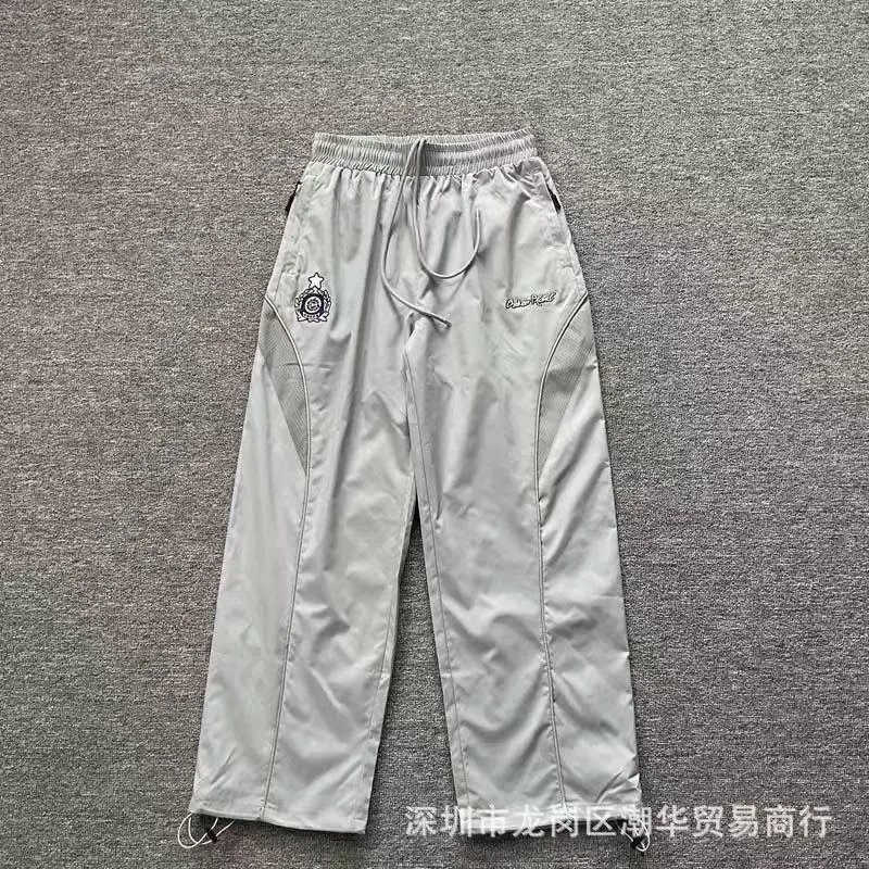 Balenciaga Trousers Wide-leg drawstring sweatpants with side stripes — 22