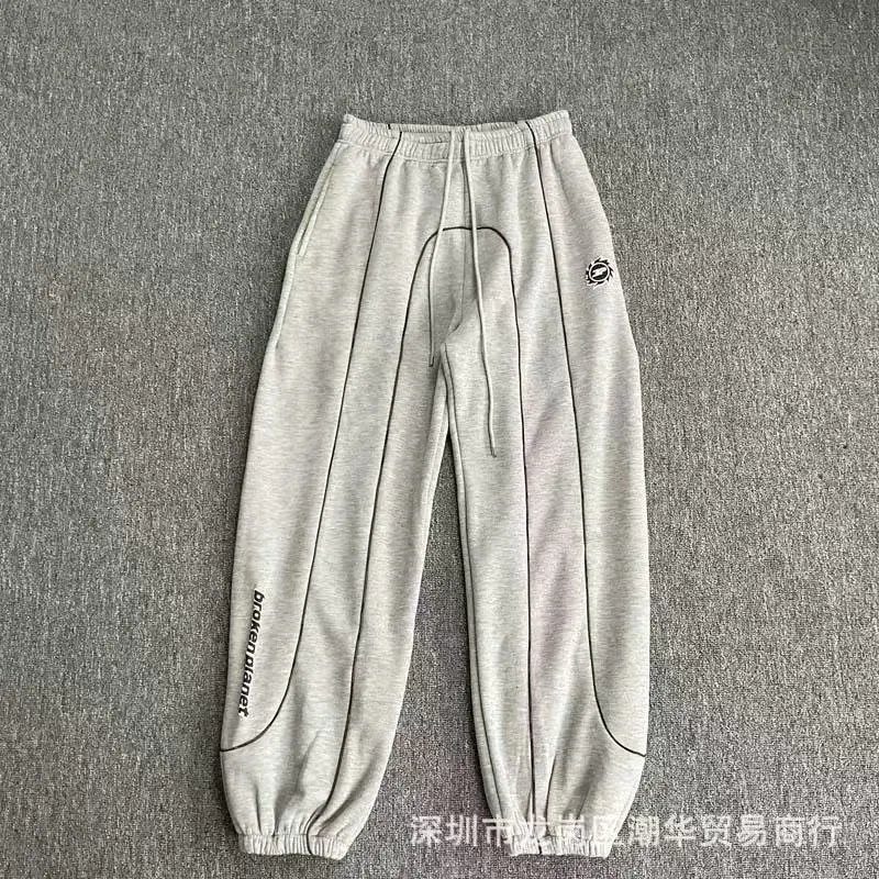 Balenciaga Trousers Wide-leg drawstring sweatpants with side stripes — 29
