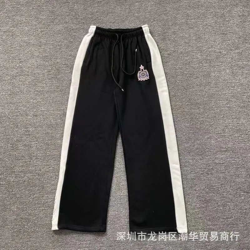 Balenciaga Trousers Wide-leg drawstring sweatpants with side stripes — 21