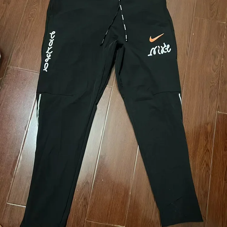 Nike Mixed sportswear apparel — Berlin Pants
