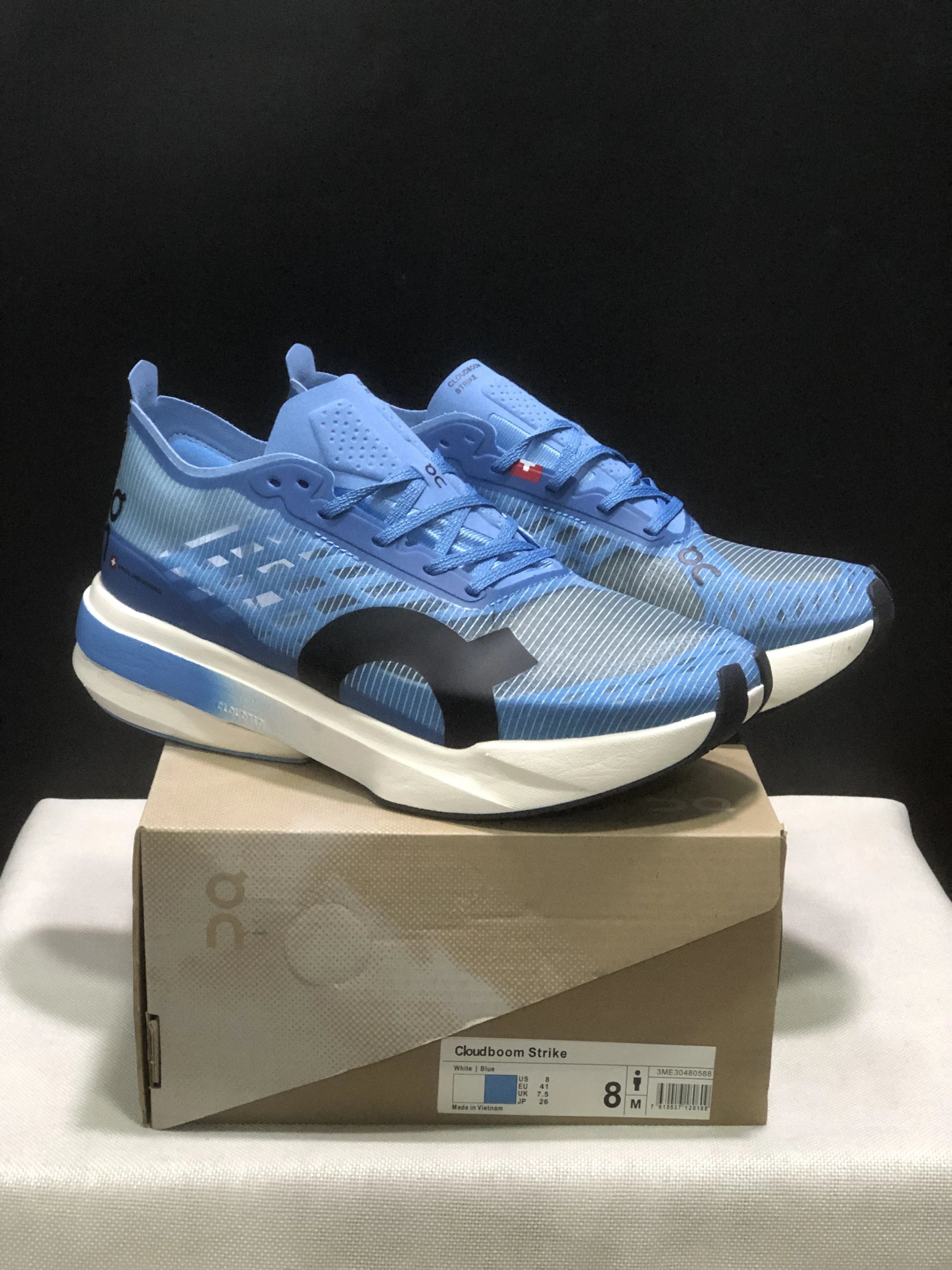 On Sneakers Cloudboom Strike and mesh running shoe styles — 1