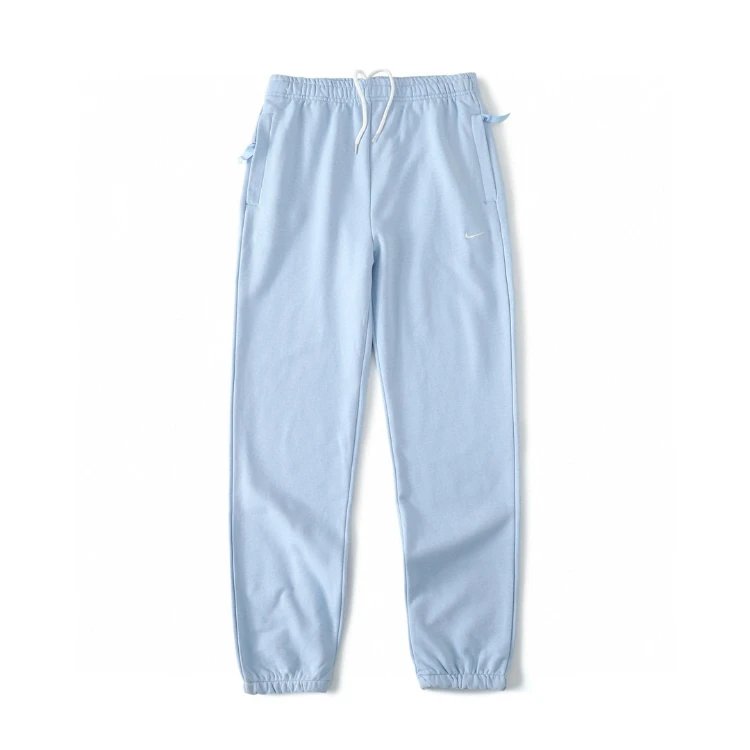 Nike Trousers Tapered sweatpants with embroidered Swoosh logo — Light blue