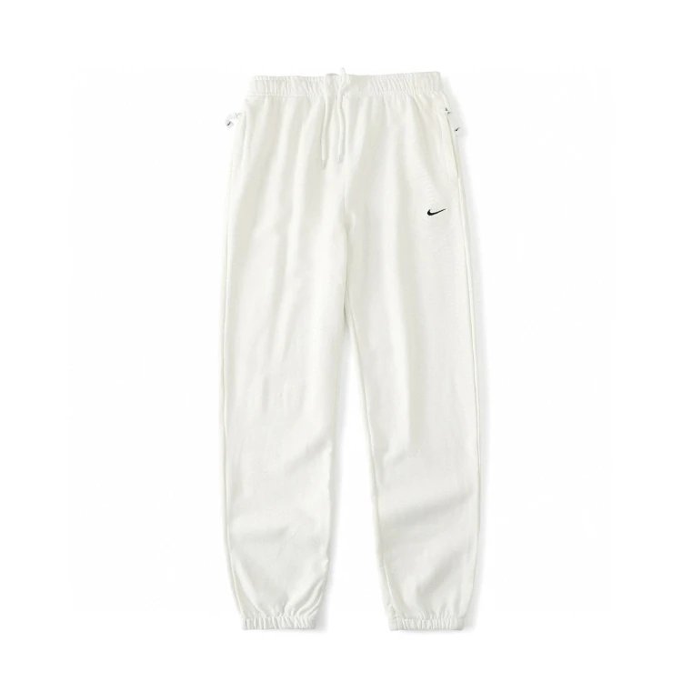 Nike Trousers Tapered sweatpants with embroidered Swoosh logo — white