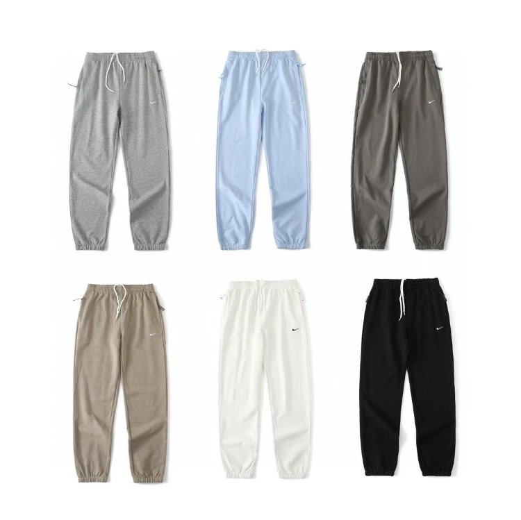 Nike Trousers Tapered sweatpants with embroidered Swoosh logo image 1