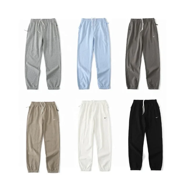 Nike Trousers Tapered sweatpants with embroidered Swoosh logo product detail image 1