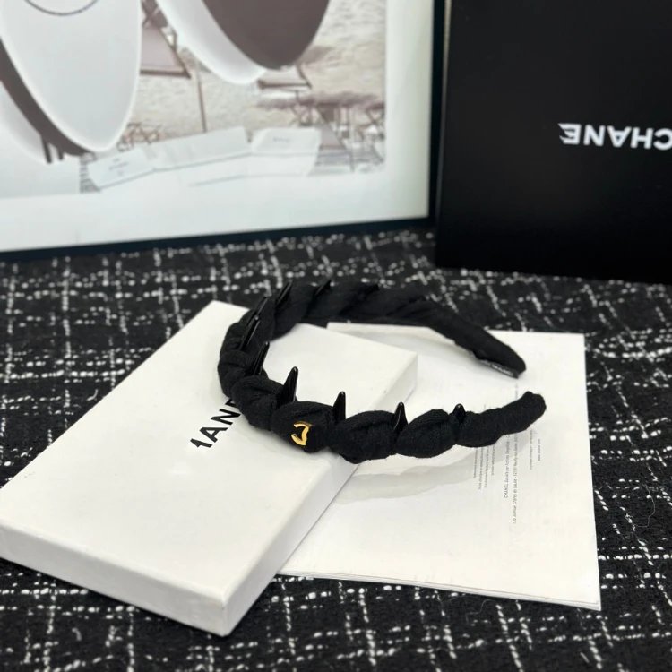 Chanel Uncategorized Braided tooth headband with CC charm — Black