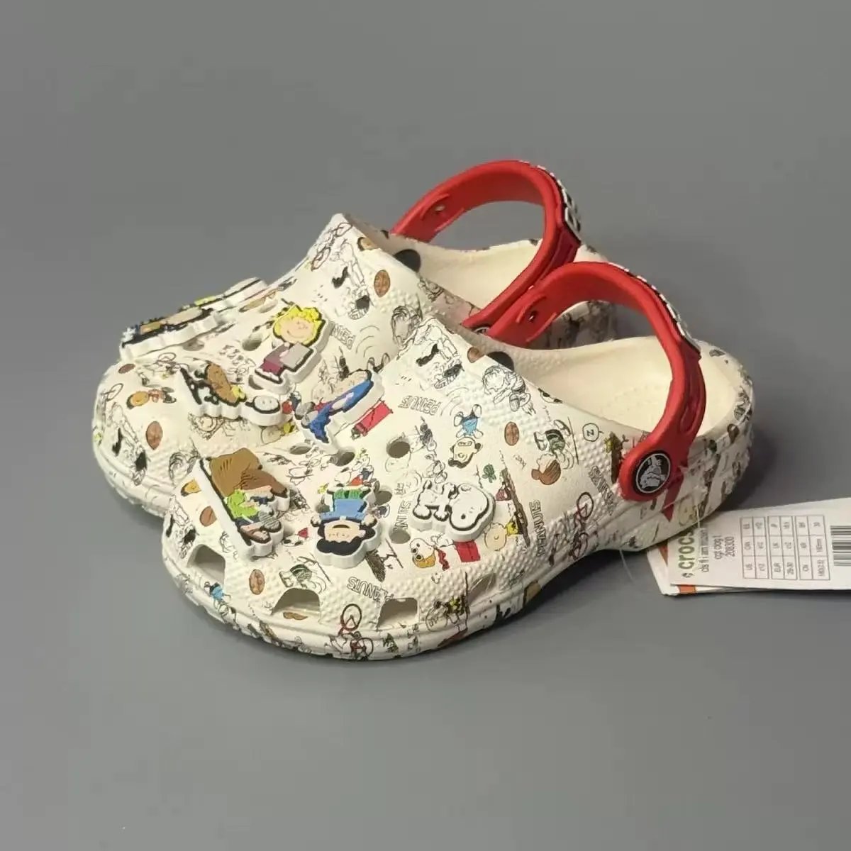 Crocs Sandals Ventilated clogs with heel straps and decorative charms — 34