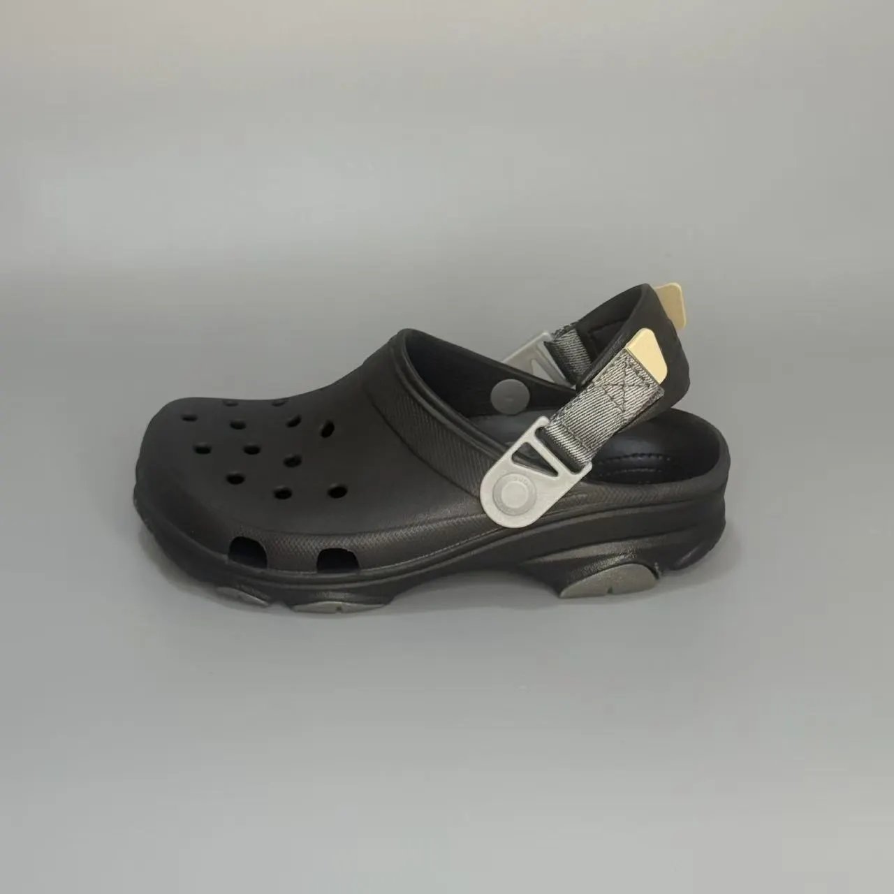 Crocs Sandals Ventilated clogs with heel straps and decorative charms — 25