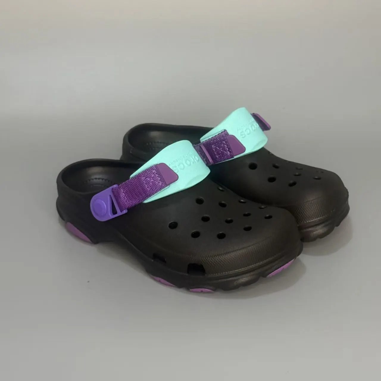 Crocs Sandals Ventilated clogs with heel straps and decorative charms — 26