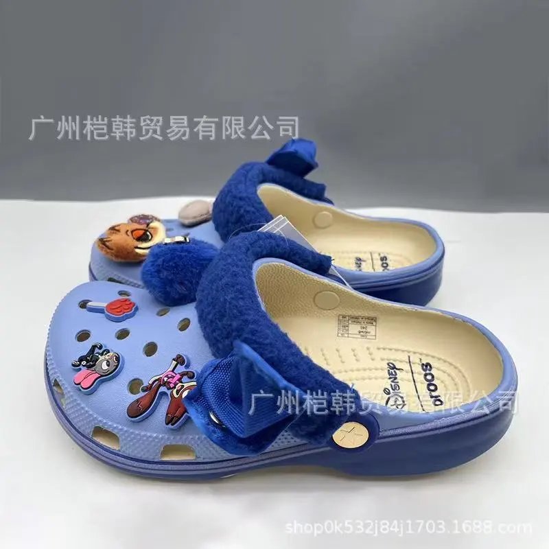 Crocs Sandals Ventilated clogs with heel straps and decorative charms — 15