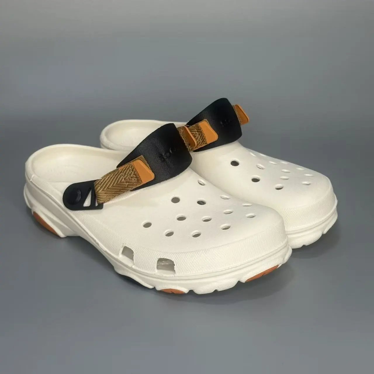 Crocs Sandals Ventilated clogs with heel straps and decorative charms — 23