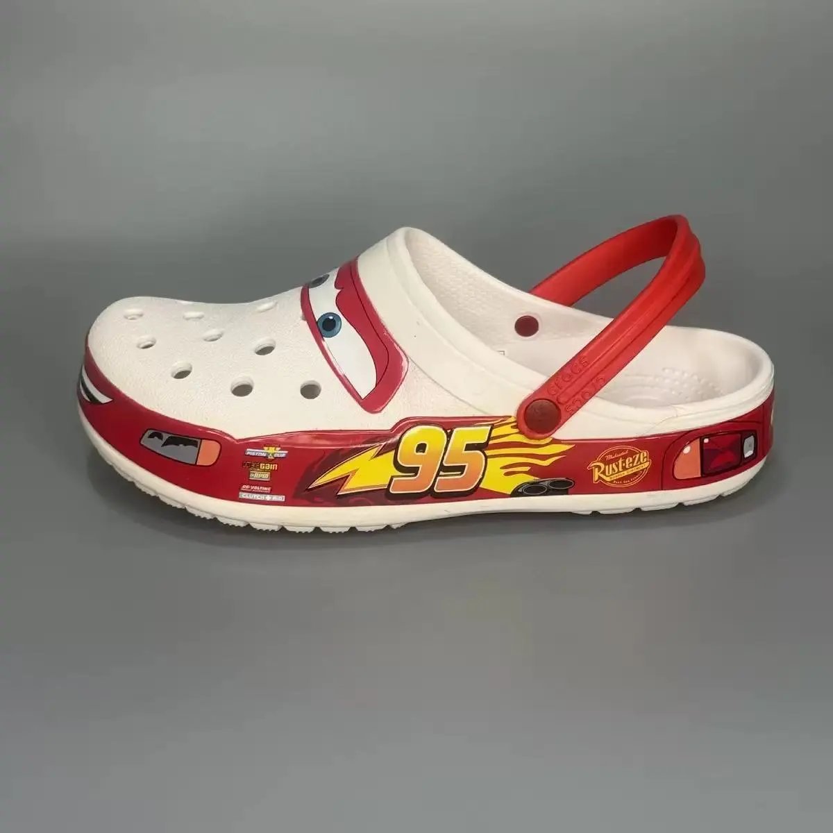 Crocs Sandals Ventilated clogs with heel straps and decorative charms — 36