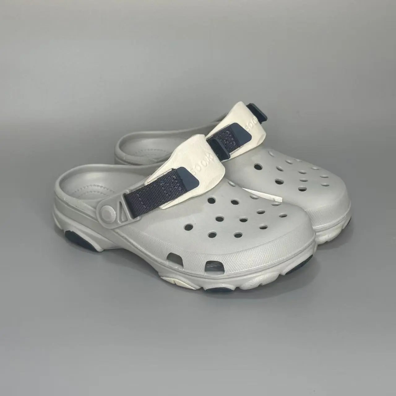 Crocs Sandals Ventilated clogs with heel straps and decorative charms — 27