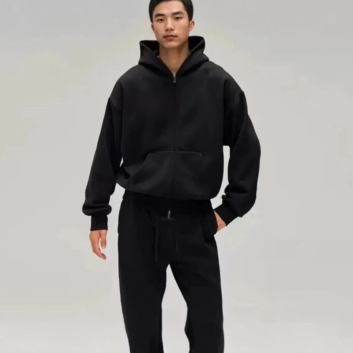 If Fear of God Essentials -> `Essentials Zip Up Hoodie` (4 words) or `Fear