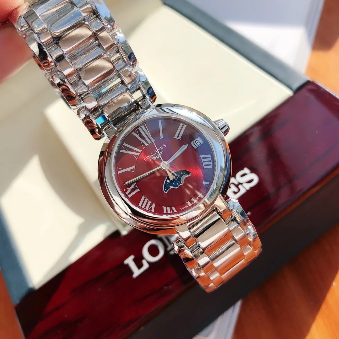 Longines horloge met rode wijzerplaat en maanfase