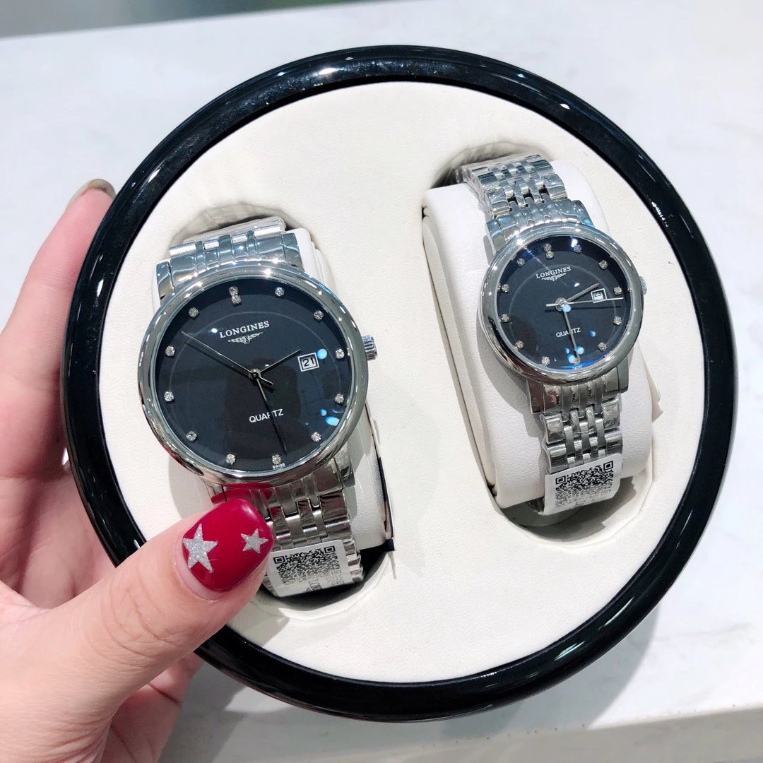 Longines paar quartz horloges met zwarte wijzerplaten en zilverkleurige schakelbanden