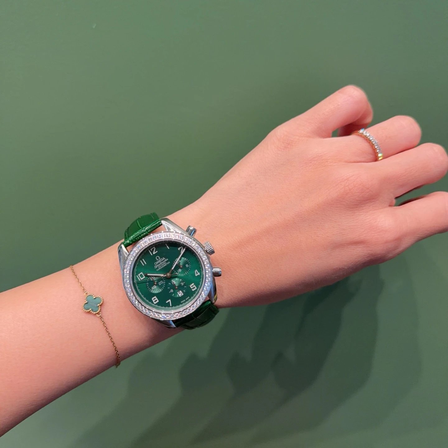 Omega Speedmaster Chronograph Watch with Green Dial and Crystal Bezel