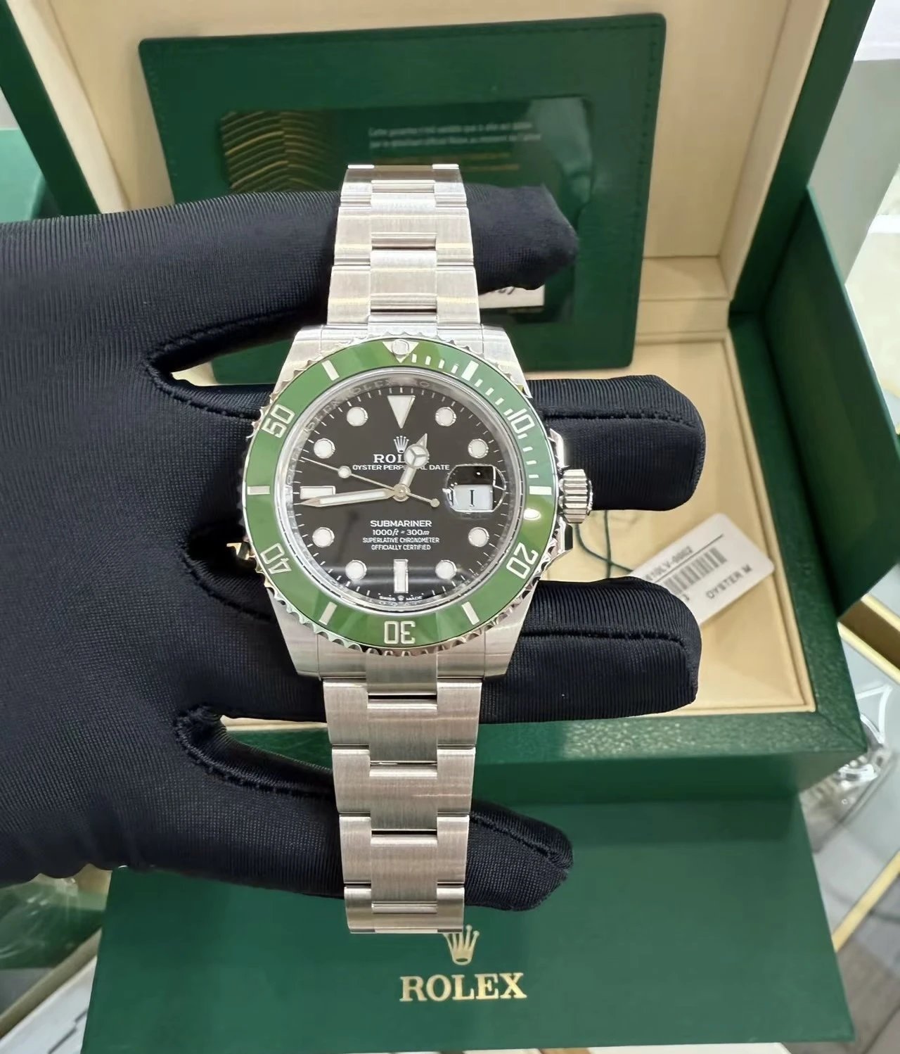 Rolex Submariner Oyster Perpetual horloge met groene bezel en zwarte wijzerplaat