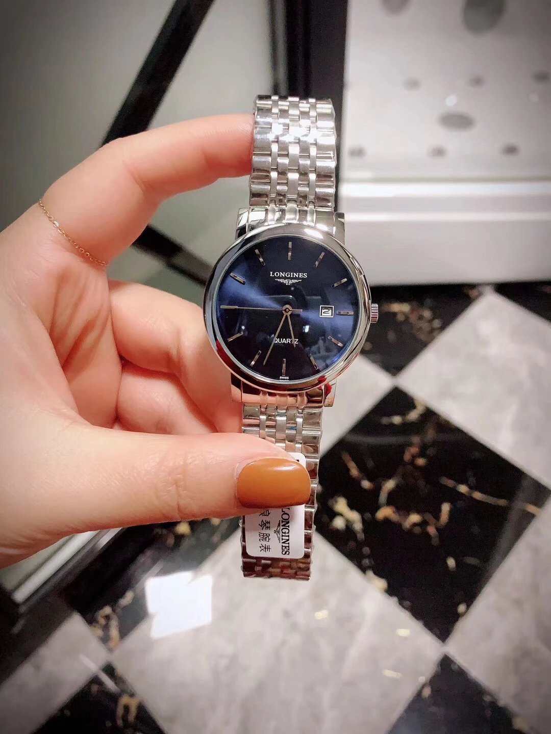 Longines quartz horloge met blauwe wijzerplaat en metalen schakelband