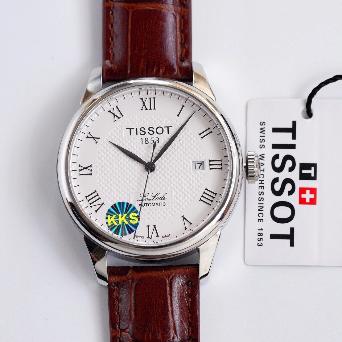 Tissot Le Locle automatisch horloge met witte wijzerplaat en bruine leren band