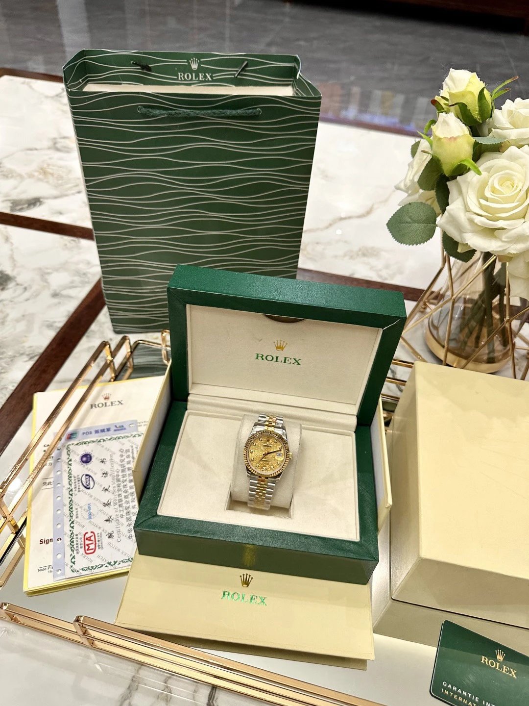 Bicolor Rolex Datejust horloge met gouden wijzerplaat