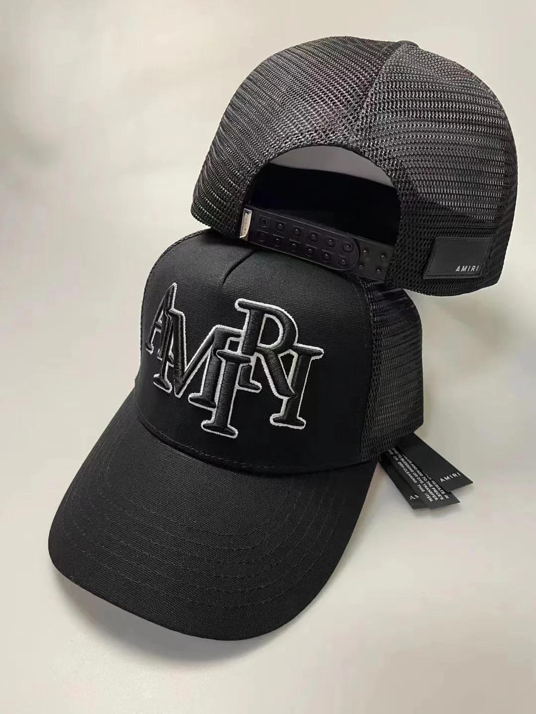 AMIRI Black Stacked Logo Trucker Hat