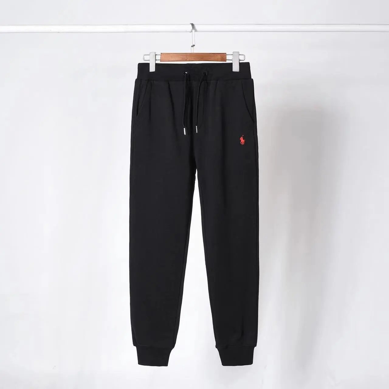 Black and red label pants
