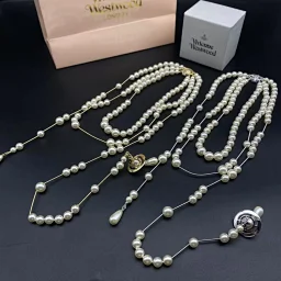 thumbnail for Broken pearl necklace gold and si**er