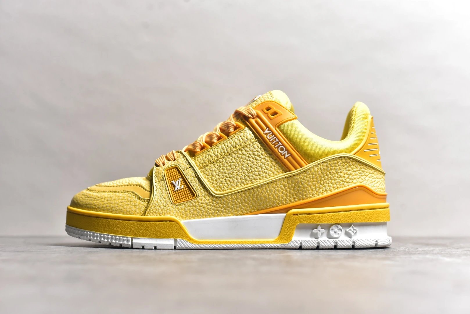 LV yellow mesh logo