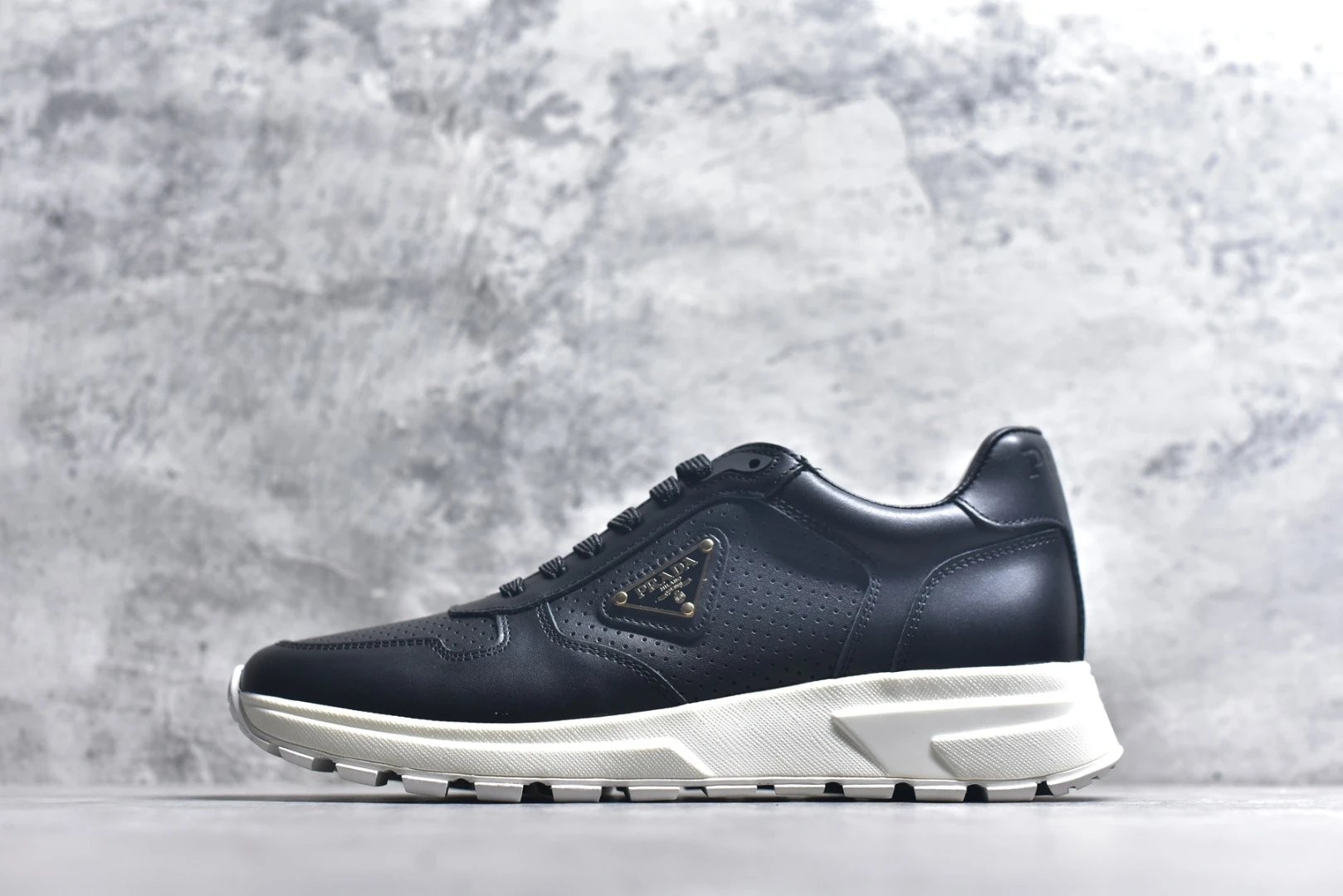 Prada Sneakers Prax 01 — Prax 01 black mesh with an off-white sole