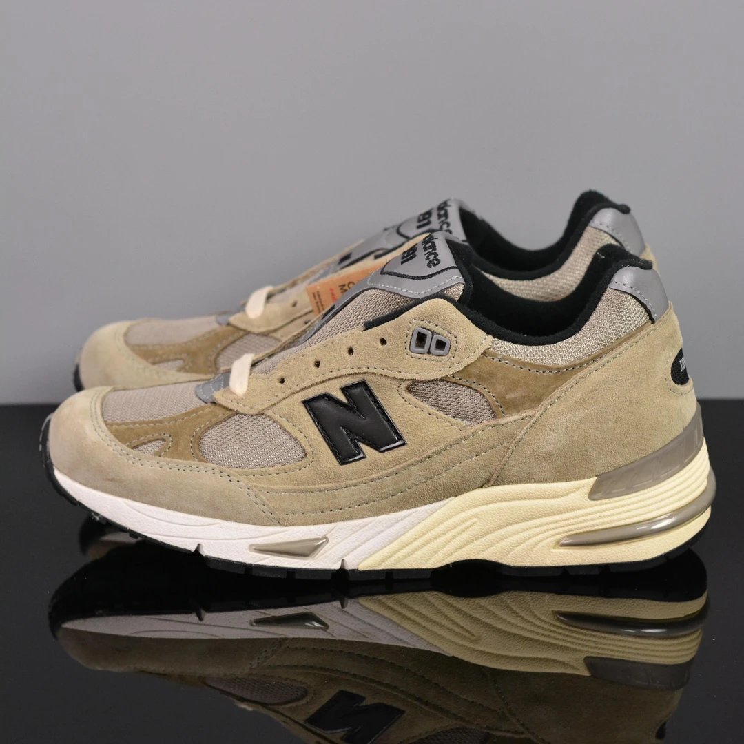 New Balance Multiple models shown — NB991 gray-brown 991JJA