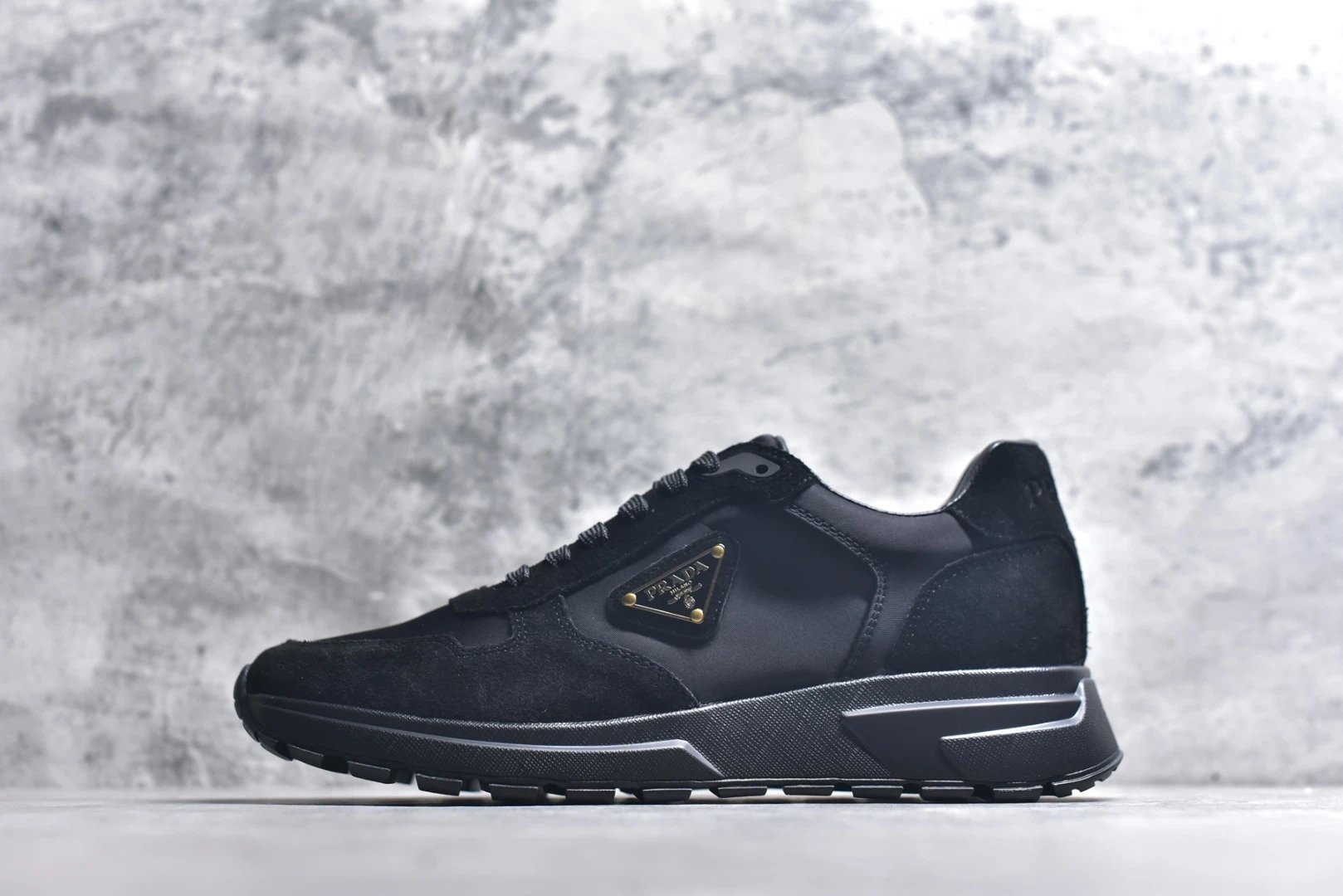 Prada Sneakers Prax 01 — Prax 01 pure black suede with gold logo