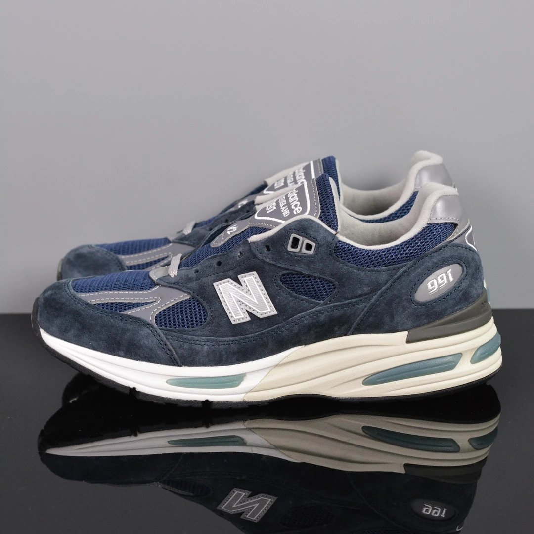New Balance Multiple models shown — NB991V2 Navy Blue U991NV2