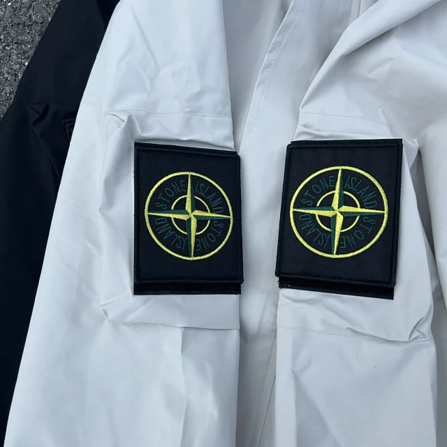 Stone Island Jackets Hooded zip-up shell jacket with compass sleeve patches product detail image 34