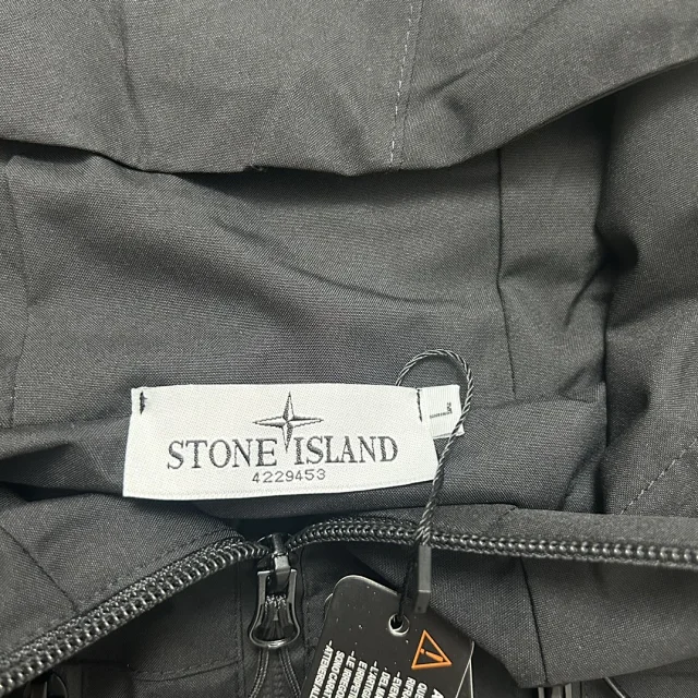 Stone Island Jackets Hooded zip-up shell jacket with compass sleeve patches product detail image 28