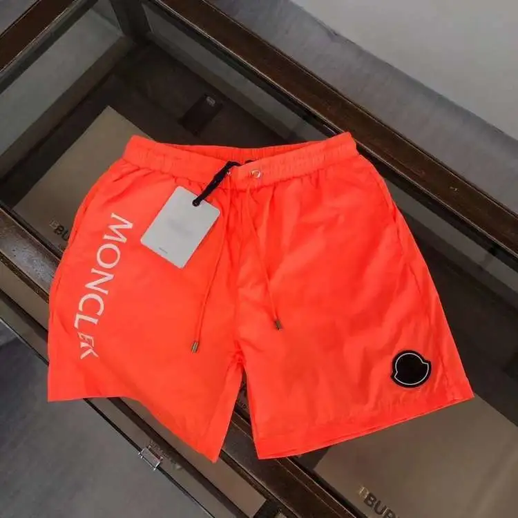 Moncler — Bright Orange Nylon Quick-Drying Beach Shorts with Vertical Lettering