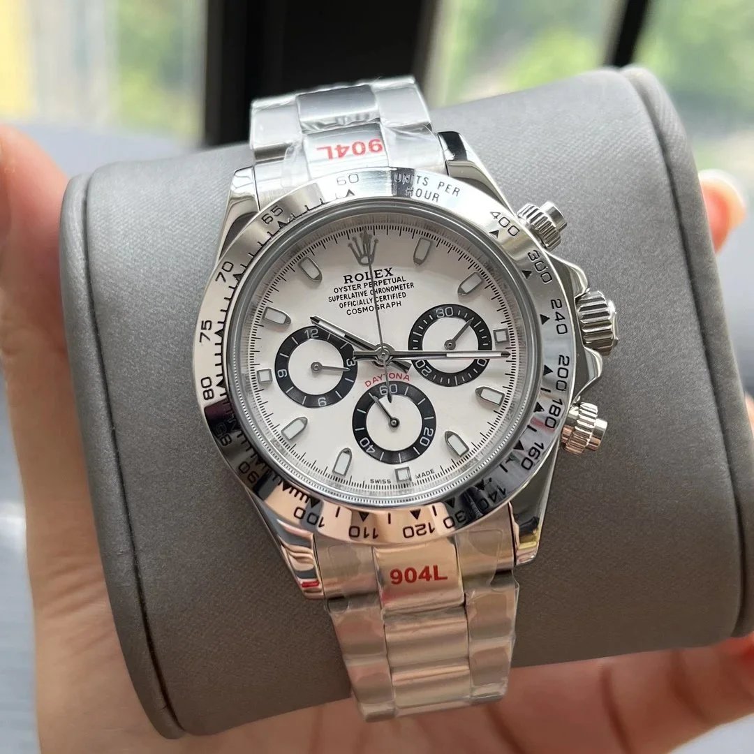 Silver case, silver bezel white dial, steel band, black subdial