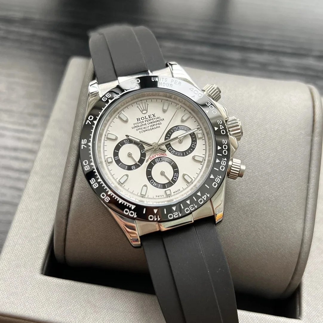 Silver case, baton index white dial, black rubber strap, black bezel