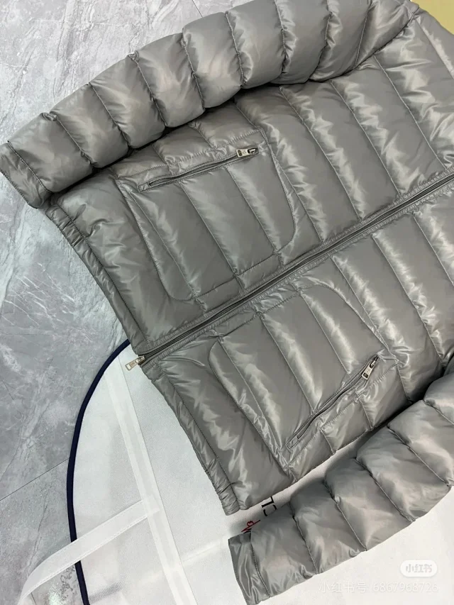 Moncler Down Jackets Quilted stand-collar puffer jacket with zip pockets product detail image 10