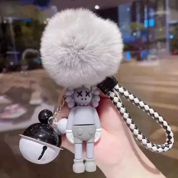 Kaws Companion Keychain with Faux Fur Pom-Pom and Bell Charm Gray / White Accessories Jewelry - 1