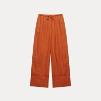 Pants are dark orange.