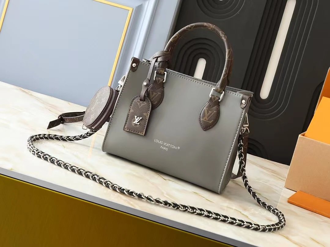 A grey handbag from Louis Vuitton.