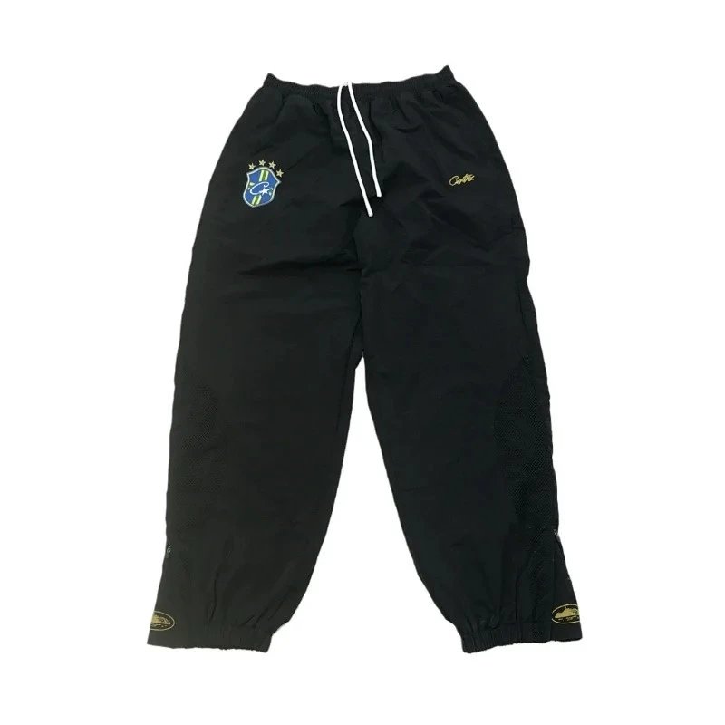 Corteiz Trousers Elastic-waist track pants with CPTZ crest and mesh leg panels — 1
