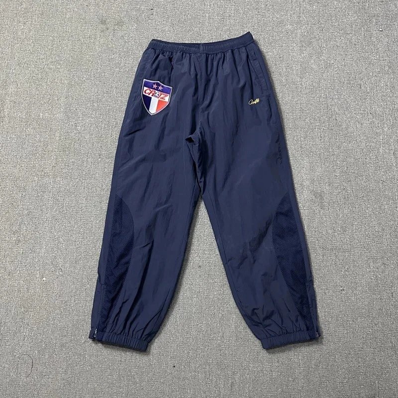 Corteiz Trousers Elastic-waist track pants with CPTZ crest and mesh leg panels — 3
