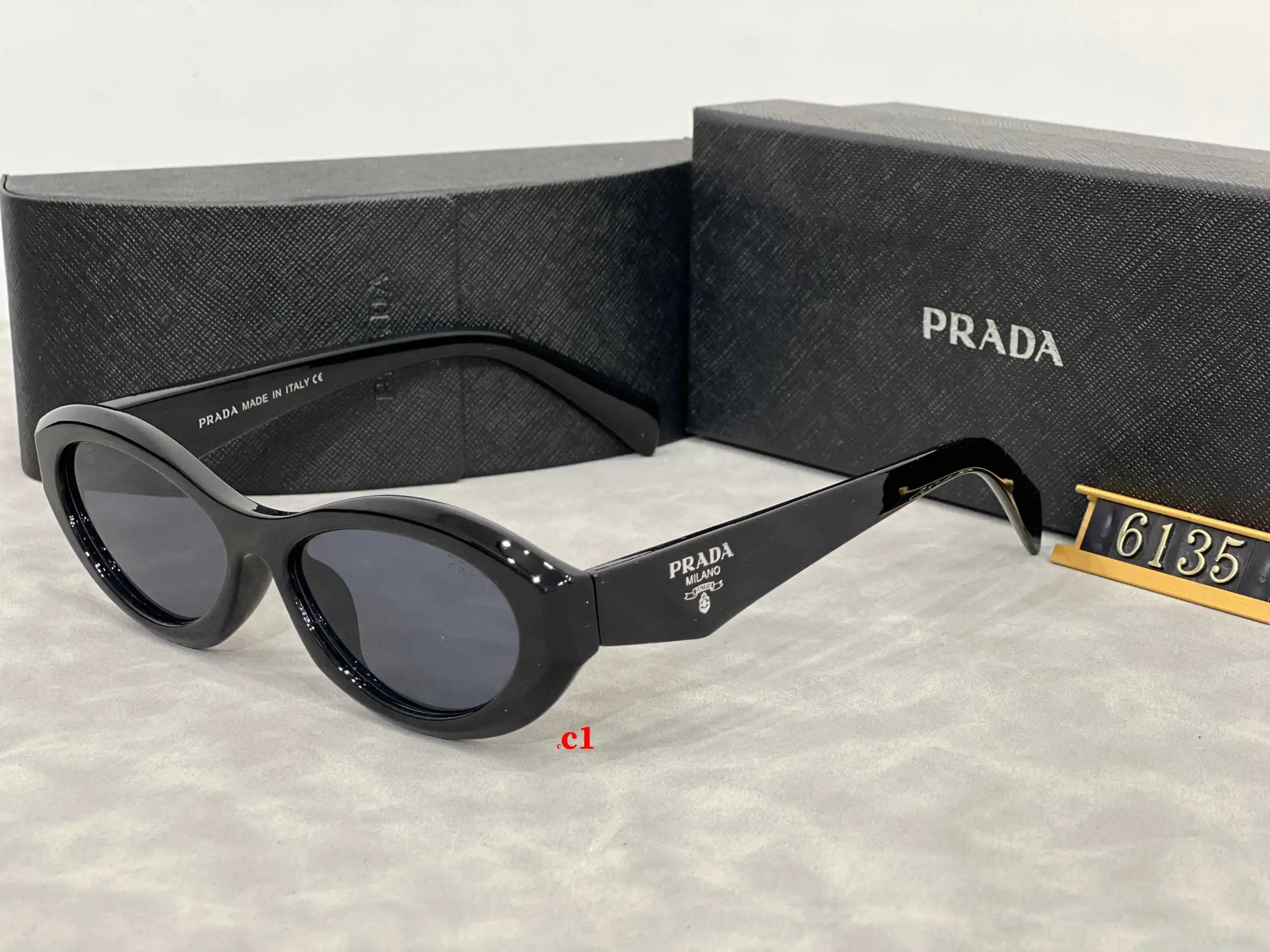 Prada Eyewear 5608 geometric-temple sunglasses — 6135-1