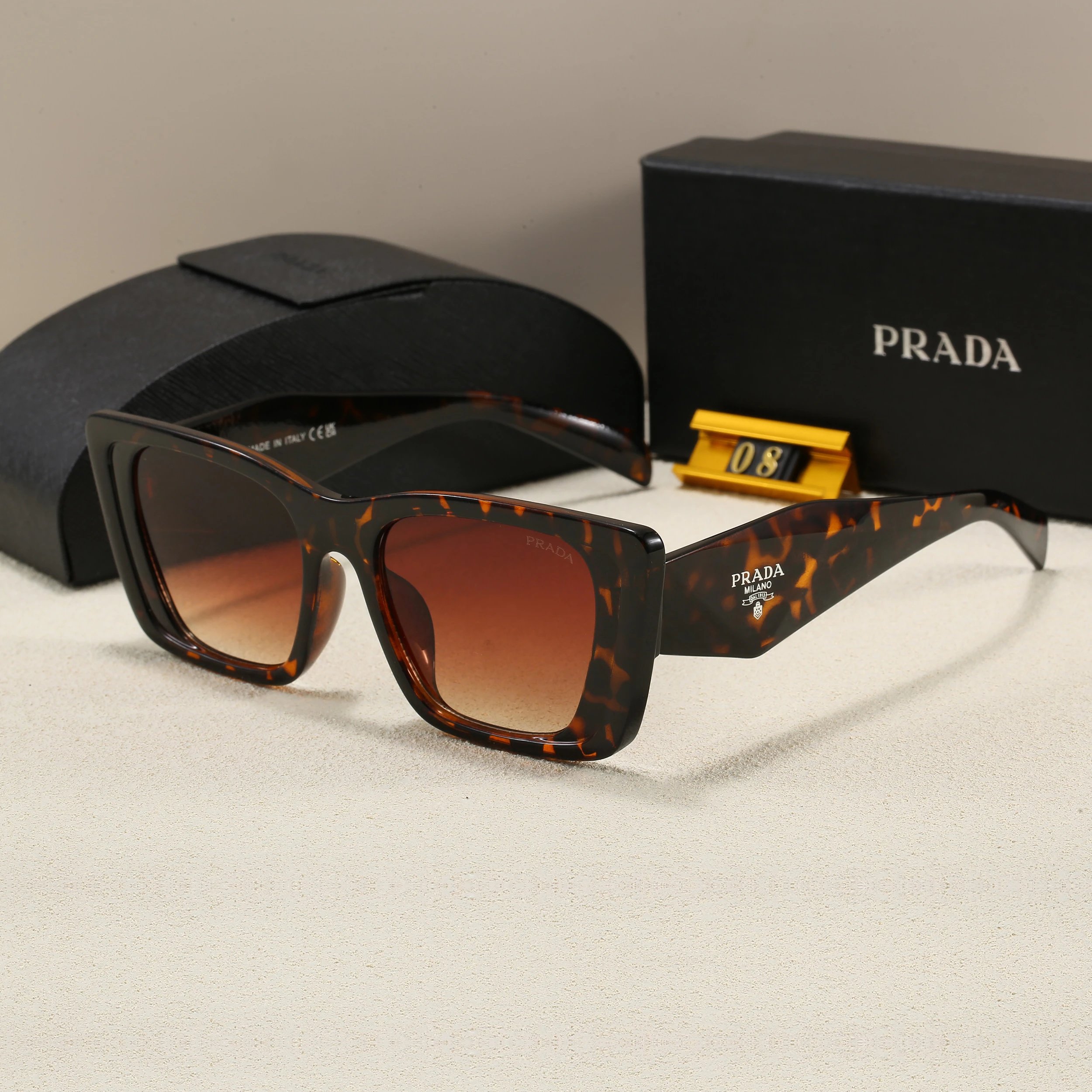 Prada Eyewear 5608 geometric-temple sunglasses — 08-4