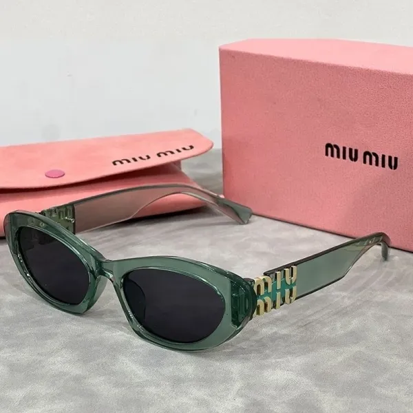 Miu Miu Cat-Eye Sunglasses Translucent Green with Gold Logo Detail - 1