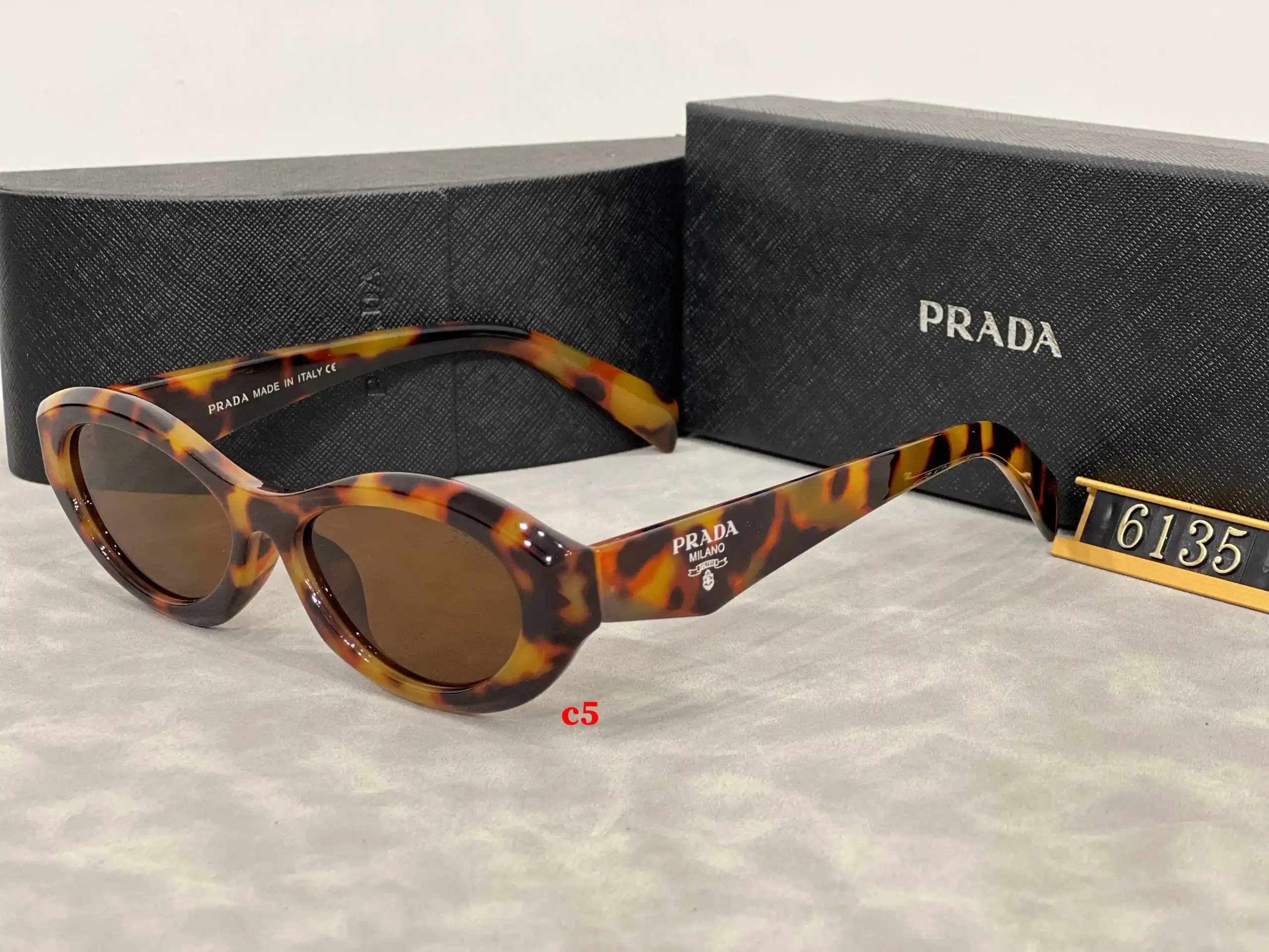 Prada Eyewear 5608 geometric-temple sunglasses — 6135-3
