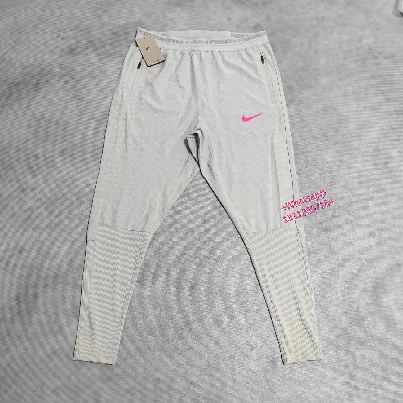 Nike Jackets Trail hooded zip-up windbreaker — White and single-pink-hook sweatpants