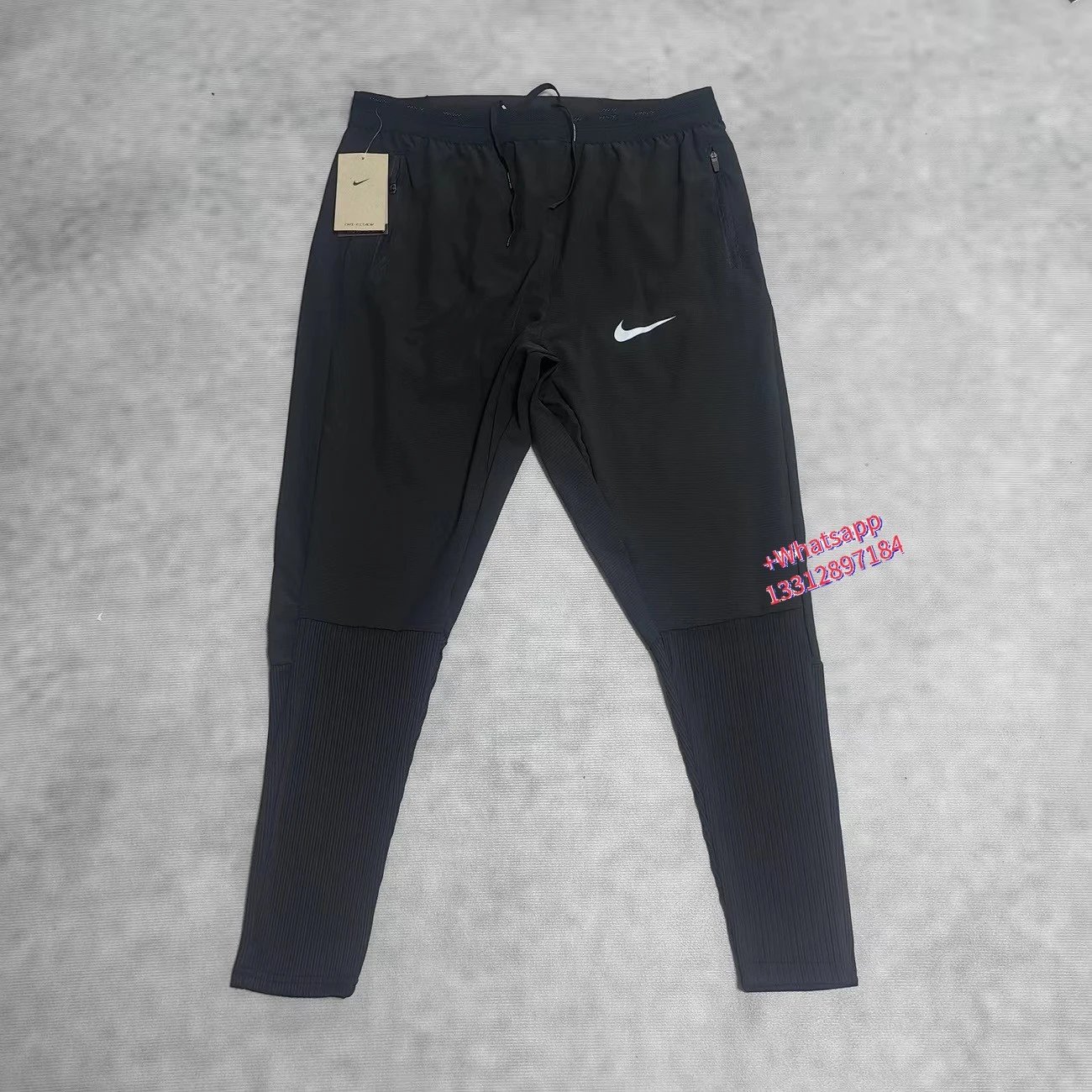 Nike Jackets Trail hooded zip-up windbreaker — Black sweatpants with white hooks